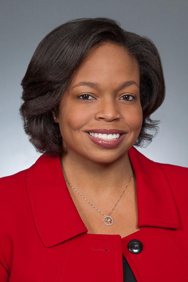 female affrican american executive, gray background