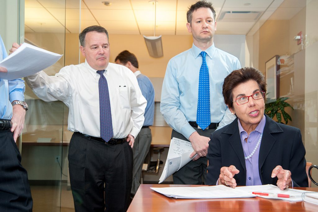 female executive presents at a corporate morning meeting