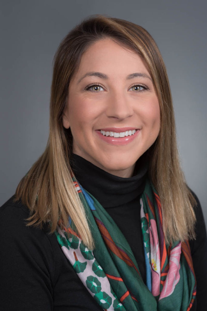 female executive portrait - standard gray background