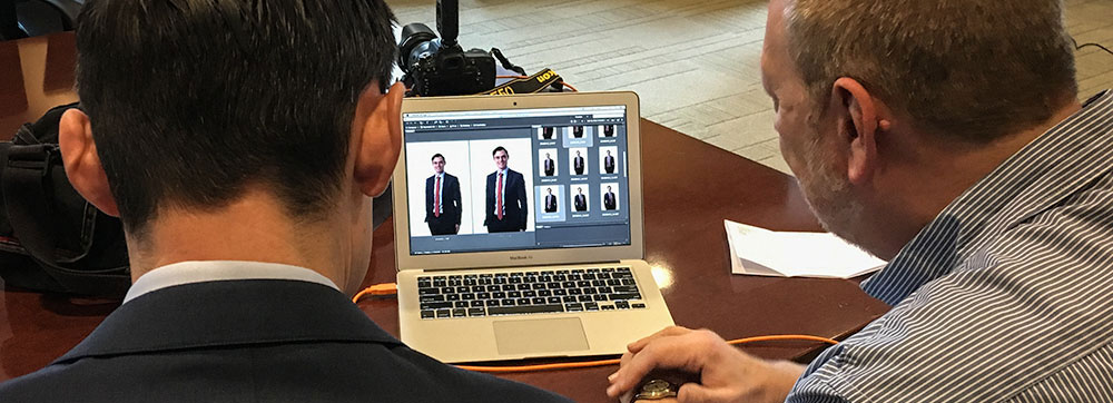 Wayne reviews portrait options with subject